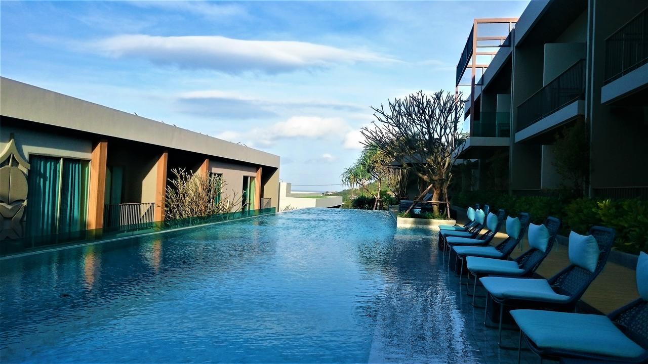 Fusion Suites Phuket Patong Kültér fotó The swimming pool at the hotel