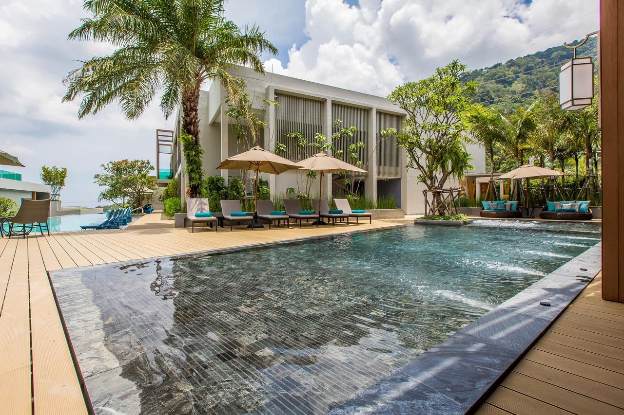 Fusion Suites Phuket Patong Kültér fotó The swimming pool at the hotel