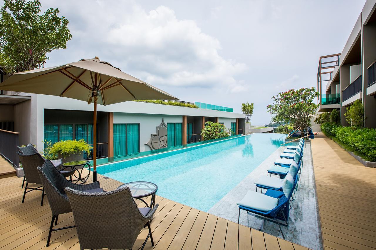 Fusion Suites Phuket Patong Kültér fotó The swimming pool at the hotel