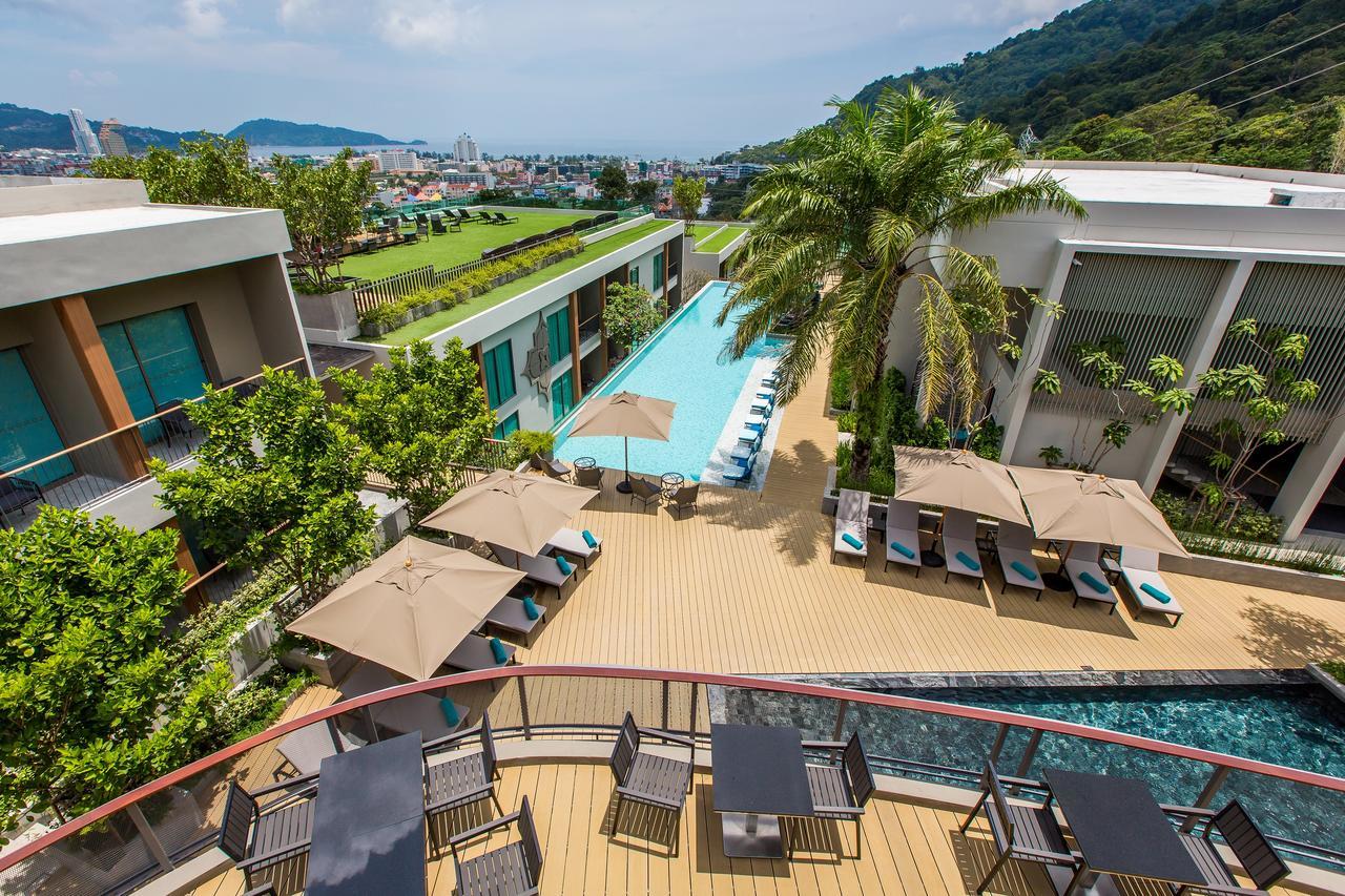 Fusion Suites Phuket Patong Kültér fotó The swimming pool at the hotel